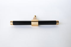 Glossy Black & Brass modern drawer pull.  Add color to cabinets with brass accents with the Piety drawer pulls by sazerac stitches.  Available in over 30 colors with the option to customize. Center mount installation drawer pull with color and brass accents.  Sophisticated colorful bathroom, dresser, vanity, or desk drawer pull.