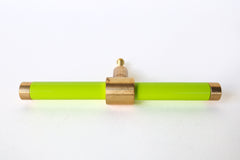 Chartreuse and brass modern drawer pull.  Add color to cabinets with brass accents with the Piety drawer pulls by sazerac stitches.  Available in over 30 colors with the option to customize. Center mount installation drawer pull with color and brass accents.  Sophisticated colorful bathroom, dresser, vanity, or desk drawer pull.