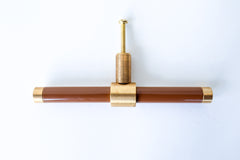 Glossy Medium Chocolate Fudge Brown & Brass modern drawer pull.  Add color to cabinets with brass accents with the Piety drawer pulls by sazerac stitches.  Available in over 30 colors with the option to customize. Center mount installation drawer pull with color and brass accents.  Sophisticated colorful bathroom, dresser, vanity, or desk drawer pull.