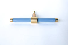 Pastel grey blue & Brass modern drawer pull.  Add color to cabinets with brass accents with the Piety drawer pulls by sazerac stitches.  Available in over 30 colors with the option to customize. Center mount installation drawer pull with color and brass accents.  Sophisticated colorful bathroom, dresser, vanity, or desk drawer pull.