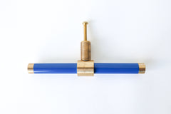 Bright Blue & Brass modern drawer pull.  Add color to cabinets with brass accents with the Piety drawer pulls by sazerac stitches.  Available in over 30 colors with the option to customize. Center mount installation drawer pull with color and brass accents.  Sophisticated colorful bathroom, dresser, vanity, or desk drawer pull.