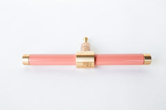 Peach and brass modern drawer pull.  Add color to cabinets with brass accents with the Piety drawer pulls by sazerac stitches.  Available in over 30 colors with the option to customize. Center mount installation drawer pull with color and brass accents.  Sophisticated colorful bathroom, dresser, vanity, or desk drawer pull.