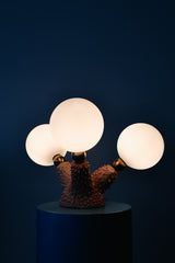 Handmade ceramic creature lamp with glowing opal globes and brass hardware, featuring a one-of-a-kind pink polyp base; sculptural modern lighting for eclectic interiors