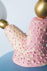 Detail of textured pink ceramic lamp base with bumpy glaze, showing handcrafted polyp-inspired texture on unique art lamp
