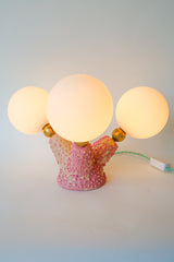 Handmade pink ceramic creature lamp with glowing frosted G9 glass globes, bumpy bubblegum texture, and mint green cord — unique sculptural lighting for eclectic and whimsical interiors