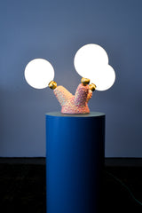 Close-up of handmade ceramic lighting base in pink and cream glaze with raised bubble texture, showcasing the artistic craftsmanship of the Pink Polyp Lamp