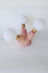 Handmade pink ceramic creature lamp with glowing frosted G9 glass globes, bumpy bubblegum texture, and mint green cord — unique sculptural lighting for eclectic and whimsical interiors