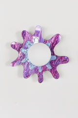Purple and periwinkle splatter-shaped wall sconce with a frosted globe, perfect for artistic spaces.