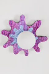 Purple and periwinkle splatter-shaped wall sconce with a frosted globe, perfect for artistic spaces.