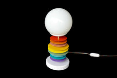 A true statement piece, the Vertebrale lamp by Sazerac Stitches features a frosted glass globe, powder-coated steel discs in vivid colors, and a sturdy marble base. It’s perfect for adding vibrant energy and artistic flair to your décor.