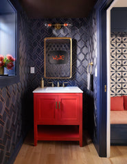 Jewelbox Navy and Persimmon Red bathroom makeover featuring our brass and flame Cadiz Sconce