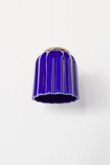Marcella ceramic wall sconce in high-gloss glazed cobalt blue with brushed brass hardware, featuring a fluted silhouette and jewel-toned finish. This bold statement light blends classic craftsmanship with modern maximalist style—ideal for traditional powder rooms, eclectic interiors, or coastal-inspired spaces seeking a vibrant pop of color.