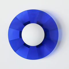 blue pop-art inspired wall sconce with etched stripes and a white glass globe.  Adds whimsy to any space.