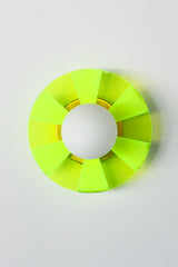 Neon Green Chartreuse etched wall plate.  Pop art inspired lighting designed by Sazerac Stitches in New Orleans LA.  Picture of the light off in natural lighting on a white wall with a brass wallplate.