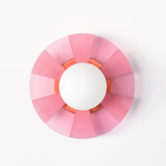 Pastel Pink pop-art inspired wall light fixture sconce.  Made of translucent pink acrylic that has been etched so that some parts are more opaque than others. The etching pattern is a stripe pattern.  Mimics pop art design and creates a fun shadow when the light is on.  Designed and made in New Orleans, LA.