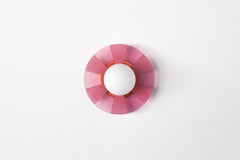 Pastel Pink pop-art inspired wall light fixture sconce.  Made of translucent pink acrylic that has been etched so that some parts are more opaque than others. The etching pattern is a stripe pattern.  Mimics pop art design and creates a fun shadow when the light is on.  Designed and made in New Orleans, LA.