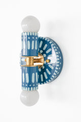 Handpainted blue and white patterned wall sconce inspired by Greece & Portugal.  Maximalist style wall sconce that has a natural element because each one is hand-painted.  The painted thalia is a perfect small sconce that doubles as a statement light fixture because of the bold design.  Great for bathrooms, hallways, and more.