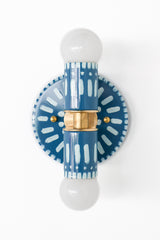 Handpainted blue and white patterned wall sconce inspired by Greece & Portugal.  Maximalist style wall sconce that has a natural element because each one is hand-painted.  The painted thalia is a perfect small sconce that doubles as a statement light fixture because of the bold design.  Great for bathrooms, hallways, and more.