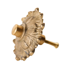 The Soleil knob features a cast brass sun-shape with a modern cap.  Adds a touch of regency to any home decor. The cast brass component of the knob is made in italy.  Adds texture to any antique or modern piece of furniture and cabinetry. Beautiful, rich raw brass fininsh.