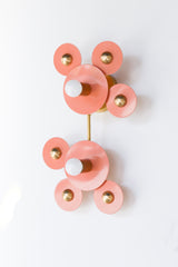 Peach & Brass Modern two light wall sconce made by Sazerac Stitches