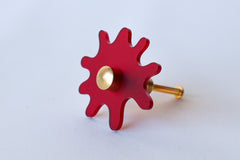 Frosted Red Acrylic & Brass modern and artistic paint splat inspired drawer pull knob.  Colorful asymmetric acrylic drawer pull or knob with brass details. Adds a unique touch to dressers, cabinets, and more.  Comes in pearly, glossy, and translucent acrylic in a ton of colorful option.  Adds a playful touch to 90s aesthetic or a kid-friendly space.  Unique drawer pull made to order in New Orleans. Designed by Sazerac Stitches.  Easy to install!