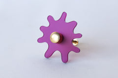 Frosted Plum Purple Acrylic & Brass modern and artistic paint splat inspired drawer pull knob.  Colorful asymmetric acrylic drawer pull or knob with brass details. Adds a unique touch to dressers, cabinets, and more.  Comes in pearly, glossy, and translucent acrylic in a ton of colorful option.  Adds a playful touch to 90s aesthetic or a kid-friendly space.  Unique drawer pull made to order in New Orleans. Designed by Sazerac Stitches.  Easy to install!