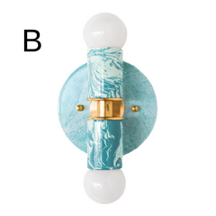 Hand-marbled modern two light wall sconce light fixture in pastel teal and.  Designed and made in New Orleans.  Colorful marbled lighting perfect for a maximalist bathroom, a pattern-loving interior designer, and more.  Each light fixture is unique.