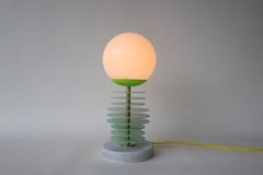 Mint and chartreuse unique stacked disc lamp with marble base and neon cord.  Unique handmade lamp designed and made in New Orleans by Sazerac Stitches.  Sculptural lamp design that can be customized into any colors. Modern geometric style lamp fixture that looks different based on the angle of viewing.  Weird unique modern and colorful table lamp.