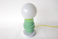 Mint and chartreuse unique stacked disc lamp with marble base and neon cord.  Unique handmade lamp designed and made in New Orleans by Sazerac Stitches.  Sculptural lamp design that can be customized into any colors.