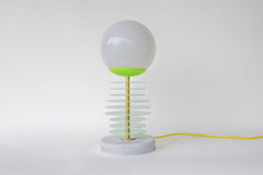 Mint and chartreuse unique stacked disc lamp with marble base and neon cord.  Unique handmade lamp designed and made in New Orleans by Sazerac Stitches.  Sculptural lamp design that can be customized into any colors. Modern geometric style lamp fixture that looks different based on the angle of viewing.  Weird unique modern and colorful table lamp.