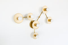 Cream and brass virgo zodiac constellation wall light fixture by Sazerac Stitches