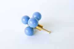 Hydrangea blue and brass oversized ball cube drawer pull shown on a white background; designed with five lacquered blue spheres arranged in a cube formation on a polished brass base, perfect for high-end interior hardware styling.