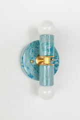 Close-up view of the Teal and Grey Marbled Thalia Sconce, a modern double-bulb wall light featuring hand-marbled teal and grey enamel with solid brass accents. This sculptural lighting fixture blends artistic flair with function, making it a standout in bathrooms, powder rooms, or hallways.