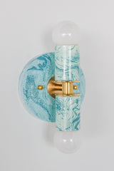 Hand-marbled modern two light wall sconce light fixture in pastel teal and.  Designed and made in New Orleans.  Colorful marbled lighting perfect for a maximalist bathroom, a pattern-loving interior designer, and more.  Each light fixture is unique.