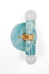 Hand-marbled modern two light wall sconce light fixture in pastel teal and.  Designed and made in New Orleans.  Colorful marbled lighting perfect for a maximalist bathroom, a pattern-loving interior designer, and more.  Each light fixture is unique.