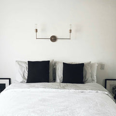 chrome light fixture over bed
