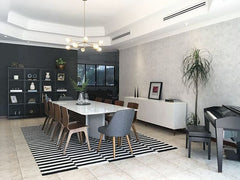 Napoleon chandelier over a modern dining room renovation