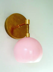 mid century modern pink and brass eyeball shade wall sconce lighting