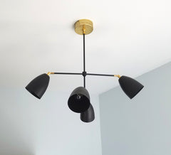 brass and black Drew chandelier sazerac stitches