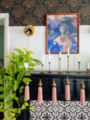 Adjustable floral wall sconce in brass