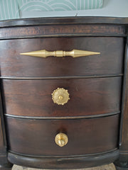 A brass double-ended spike handle from Sazerac Stitches, featuring two symmetrical pointed ends and a central mounting stem. This unique hardware piece has a bold, sculptural design, crafted from solid brass with a smooth, polished finish. Ideal for use as a decorative drawer pull, cabinet handle, or furniture accent, adding an edgy, modern touch to interiors. The warm golden hue of the brass patina enhances its vintage-inspired aesthetic.