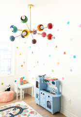Rainbow decorated kids playroom with a beautiful blue kitchen set