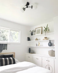 White and Black bedroom with a black flushmount ceiling light