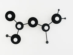 Matte Black modern light fixture in the shape of a sagittarius star constellation