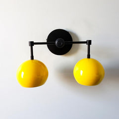 Yellow and black mid century modern inspired two light wall sconce