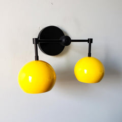 Yellow and black mid century modern inspired two light wall sconce