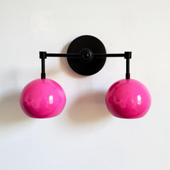pink and black midcentury modern two light wall sconce in bright fun colors