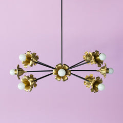 black and brass floral sputnik chandelier on a light purple background