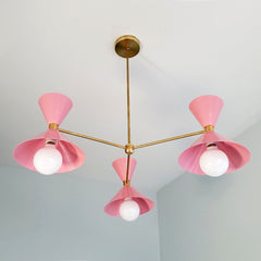 Pink and brass mid century modern three light chandelier for commercial spaces, dining rooms, colorful decor