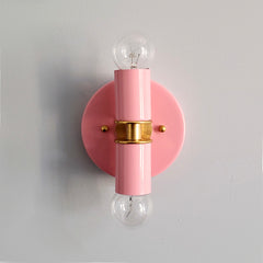 light pink and Brass two light wall sconce or flush mount ceiling light fixture in a bright vibrant color and mid century modern or art deco design